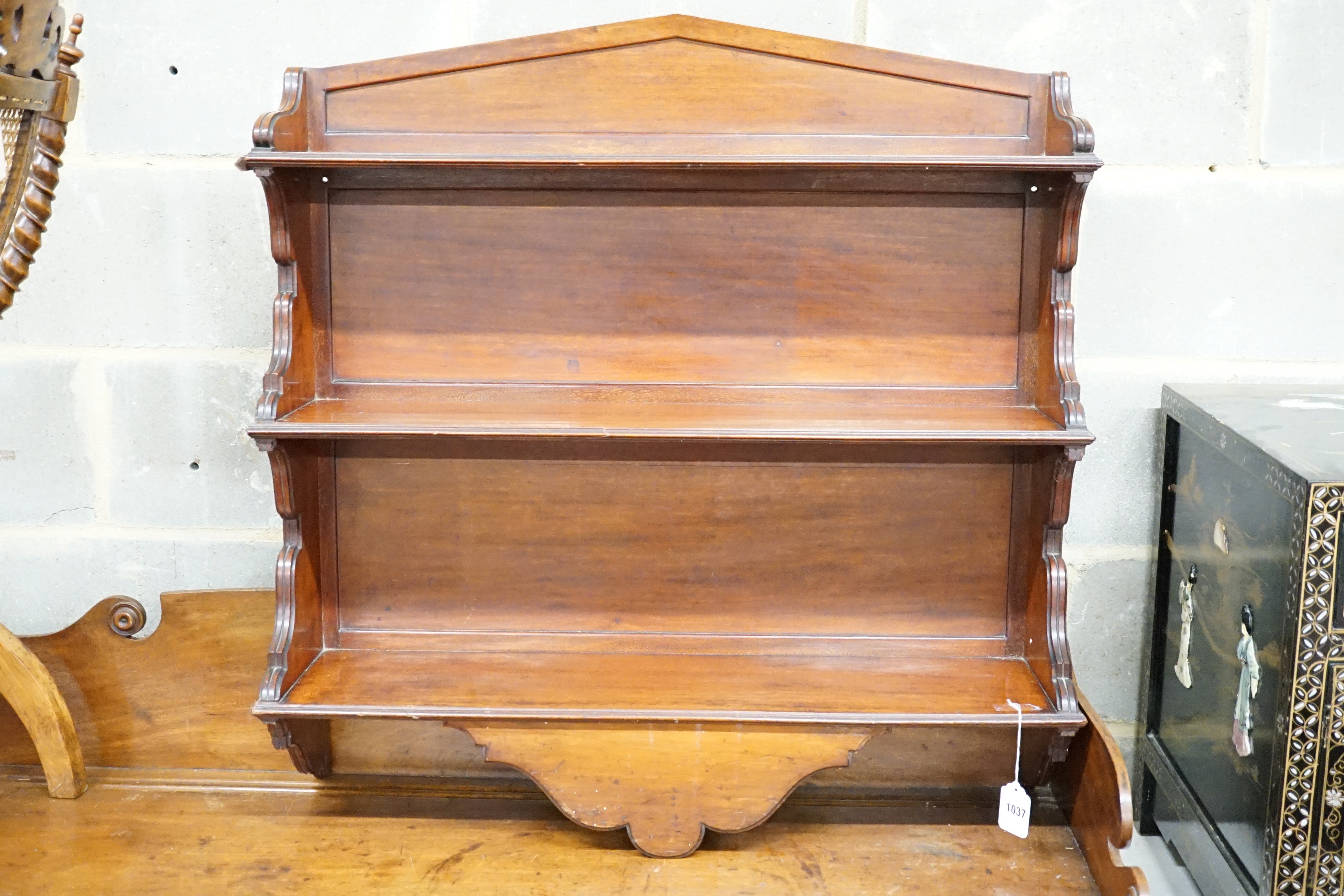 A late Victorian mahogany three tier wall shelf, width 86cm, height 86cm